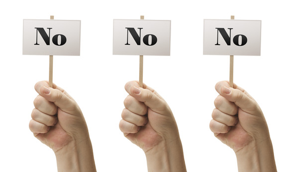 Three Signs In Male Fists Saying No, No and No Isolated on a White Background.